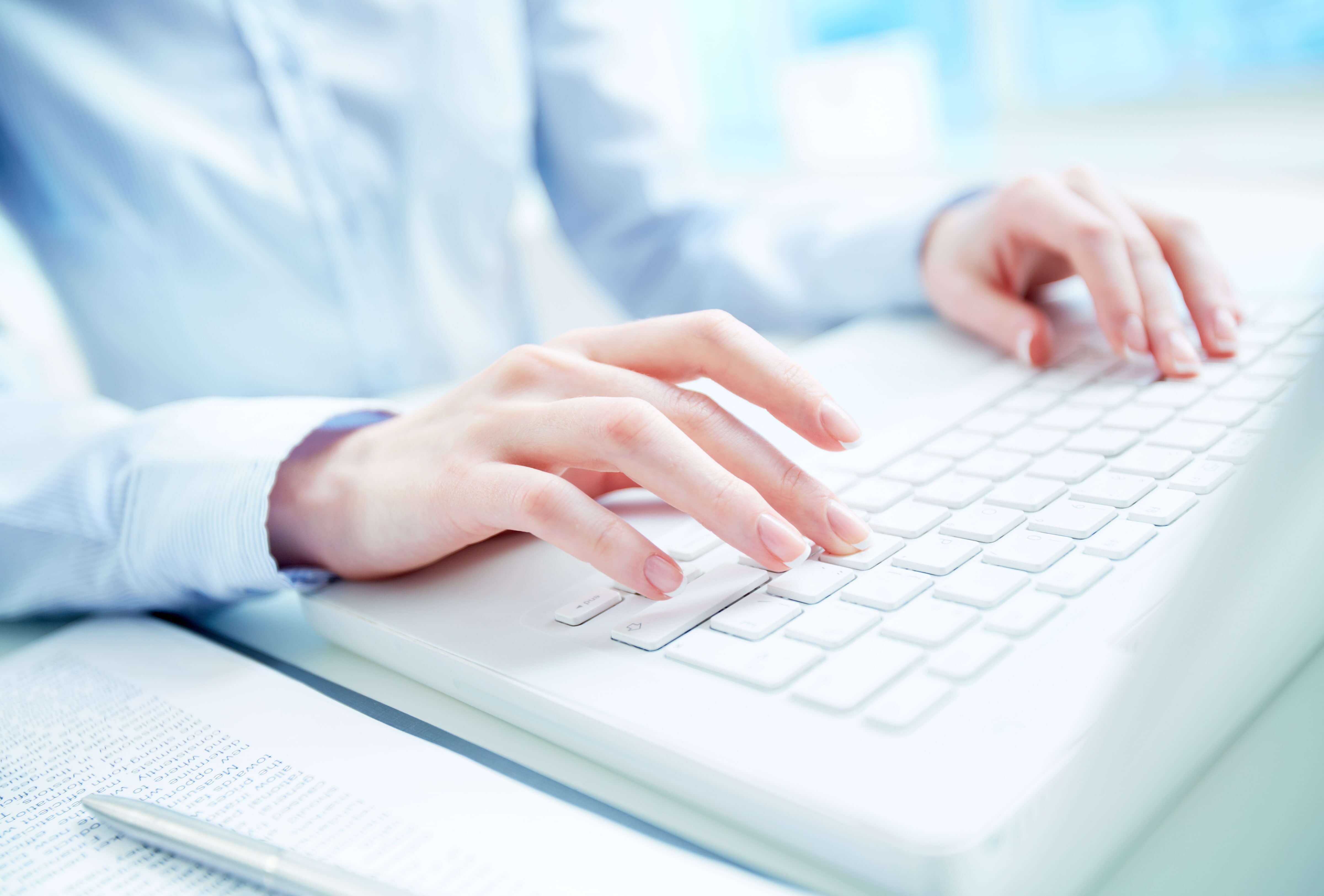Hands on the computer keyboard