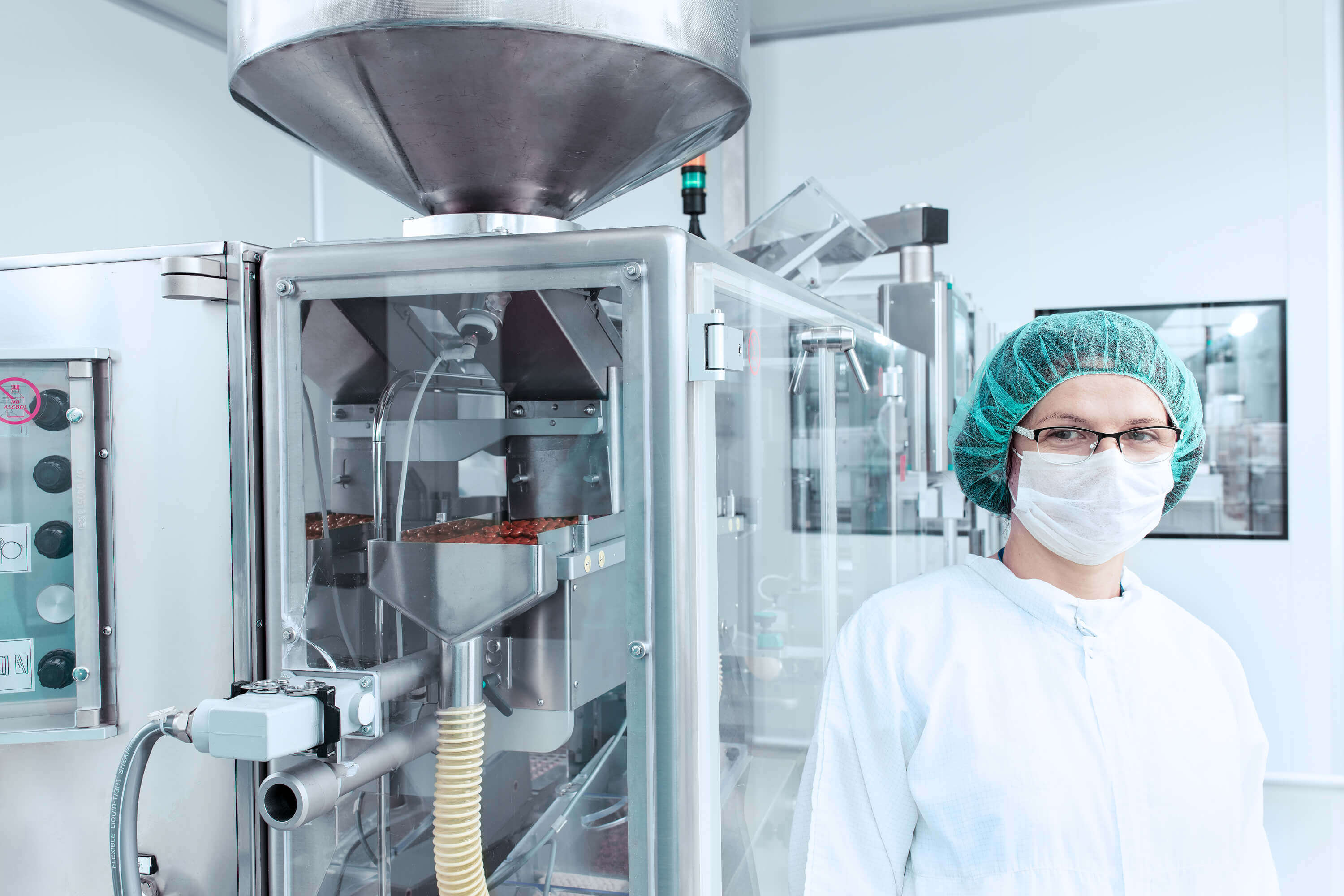 Woman in a protective mask at the machine