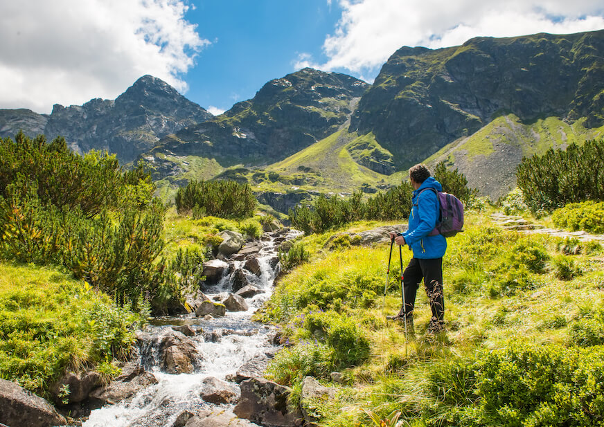 Sporty hiker near summer spring in Tatra Mountains national park, Zakopane, Poland