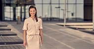 woman in a bright dress standing in the parking lot